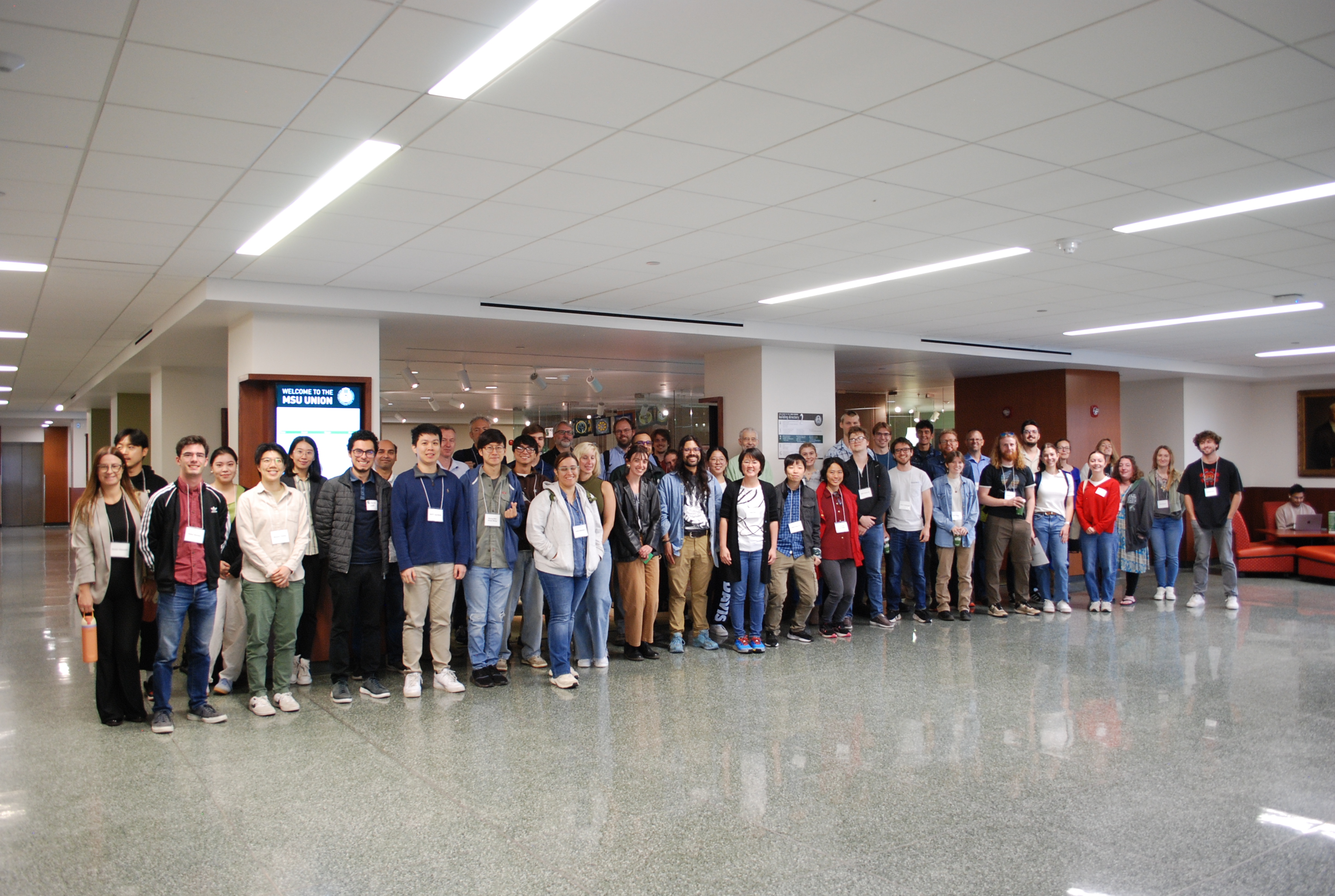 Many BMB members pose for a picture in the lobby of 