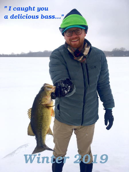 Picture of Tristan holding a bass fish