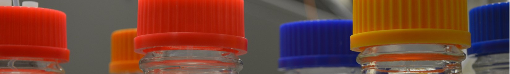 decorative image of orange blue and yellow vial caps