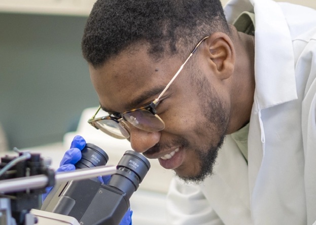 BMB student working with microscope